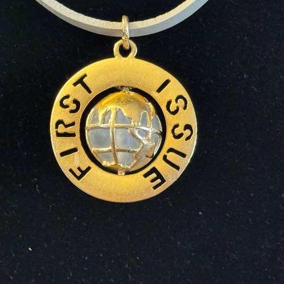 VTG G/T pendant featuring spinning globe w/text “First Issue” on outer ring - Picture 3 of 7